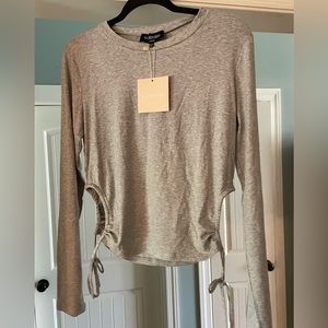 Kittenish - stretchy, grey long sleeve with side cut outs and ties